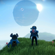 A space-suited explorer looks out from a grassy vista as a planet looms large in No Man's Sky.
